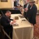 Paul signing books at Irving Berlin event