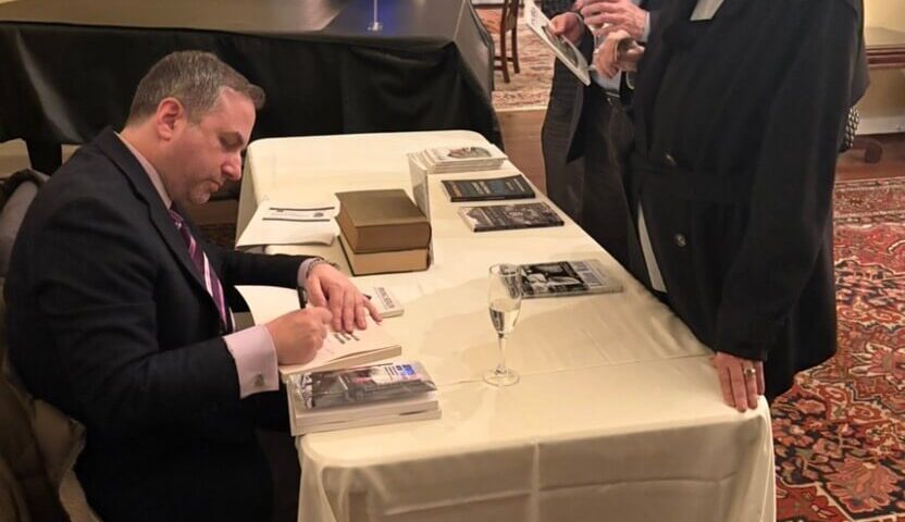 Paul signing books at Irving Berlin event