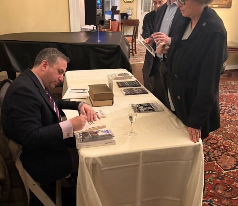 Paul signing books at Irving Berlin event